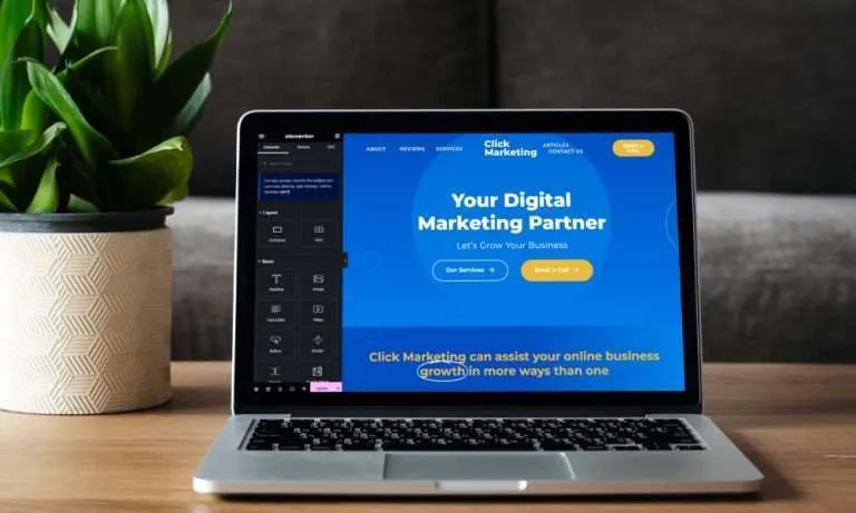 Malware Removal Service 131 Laptop displaying Click Marketing website design and development workspace